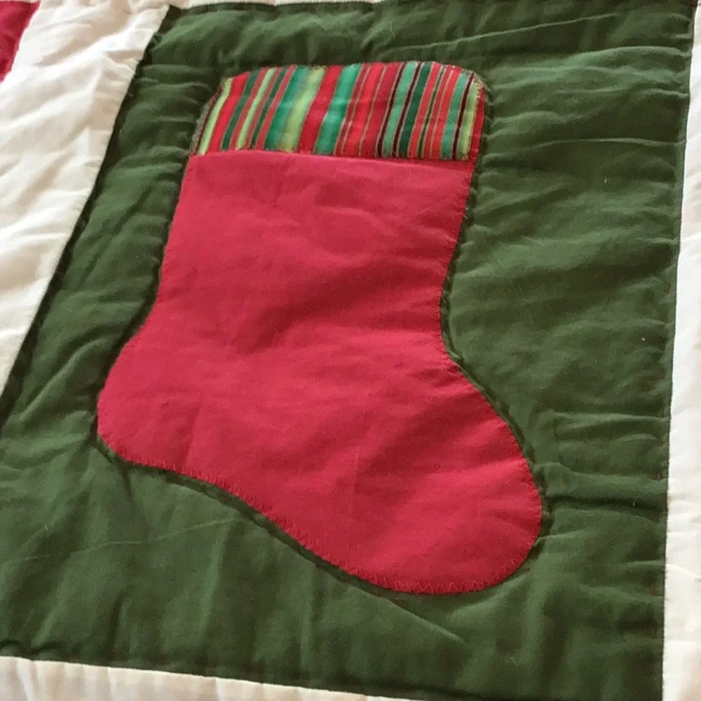 Handmade Christmas-themed applique quilt